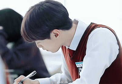 Boy In School Uniform Writing In Notebook GIF