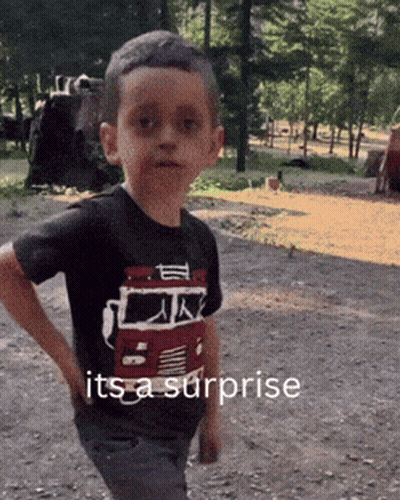 Boy In Shirt Saying It's A Surprise Hands On Hips GIF