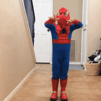 Boy In Spiderman Costume In Hallway GIF