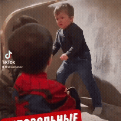 Boy In Spiderman Costume Next To Boy In Black Shirt GIF