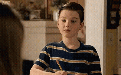 Boy In Striped Shirt Sitting At Table GIF