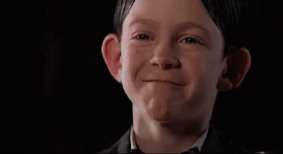 Boy In Suit And Bow Tie Making Face GIF