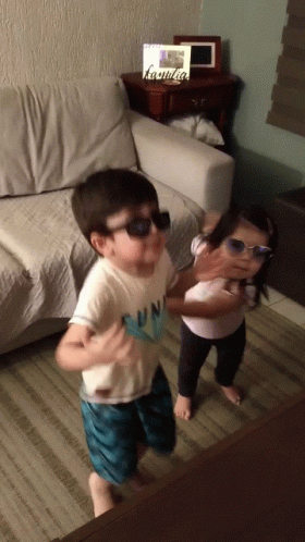 Boy In Sunglasses Next To Girl In Sunglasses GIF