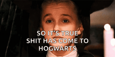 Boy In Tuxedo Behind Hogwarts Words GIF