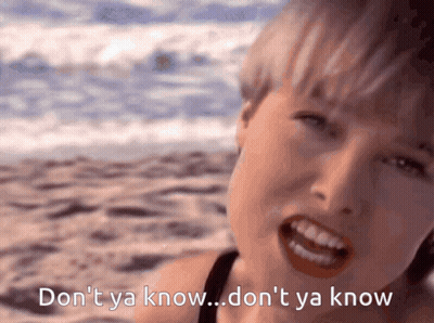 Boy In Tuxedo Standing In Front Of Hold On A Second Guys Sign GIF