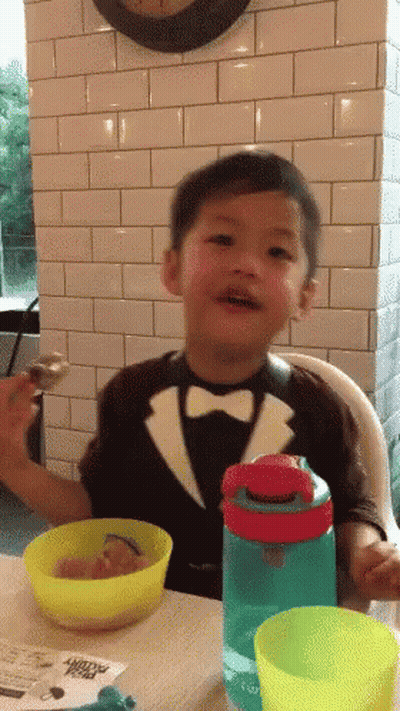 Boy In Tuxedo With Cereal And Water GIF