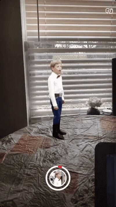 Boy In White Shirt And Blue Pants By Window GIF