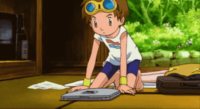 Boy In White Shirt And Blue Shorts Kneeling By Laptop GIF