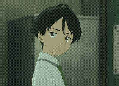 Boy In White Shirt And Green Tie Looking At Camera GIF