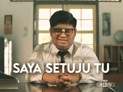 Boy In White Shirt And Tie Sitting At Desk Saya Setuju Tu GIF