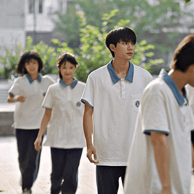 Boy In White Shirt With Blue Collar And Blue Circle GIF