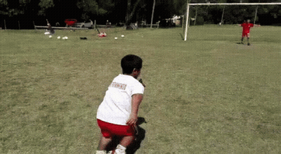Boy In White Shirt With Soccer On Back Playing Soccer GIF