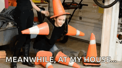 Boy In Witch Hat Surrounded By Traffic Cones Meanwhile At My House GIF
