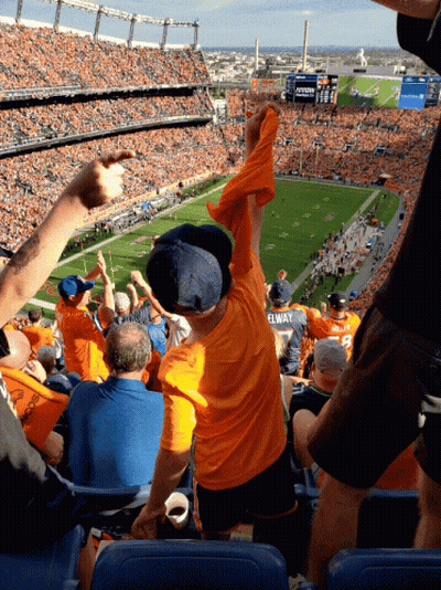 Boy In Yellow Elway Shirt At Football Game GIF