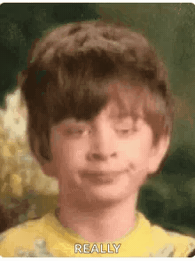 Boy In Yellow Shirt Making Funny Face GIF