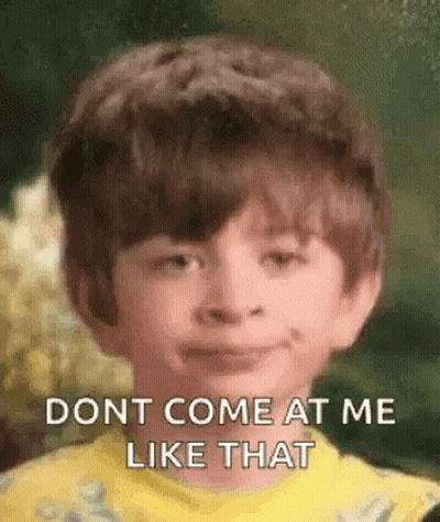 Boy In Yellow Shirt Making Funny Face GIF