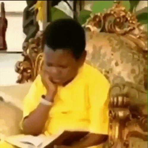 Boy In Yellow Shirt Reading Book GIF