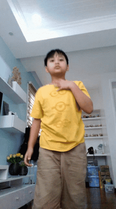 Boy In Yellow Shirt Saying Go On GIF