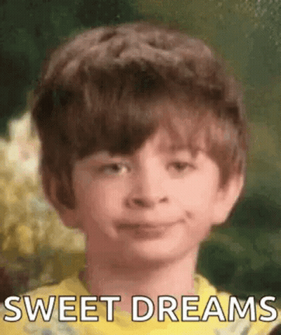 Boy In Yellow Shirt Smiling Says Sweet Dreams GIF