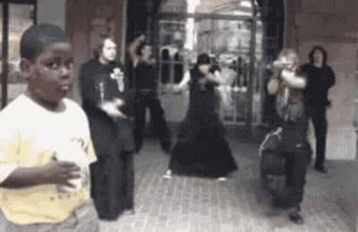 Boy In Yellow Shirt Watching People Dancing GIF