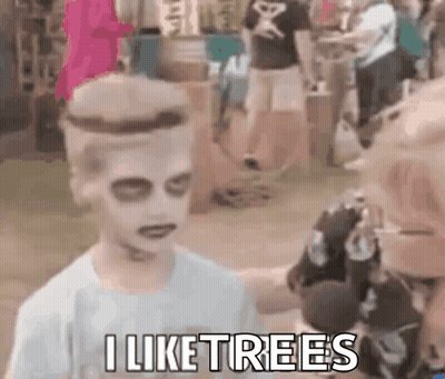 Niño disfrazado de zombi hablando al micrófono GIF