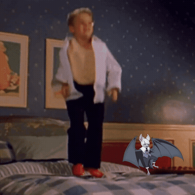 Boy Jumping On Bed Next To Bat With Wings GIF