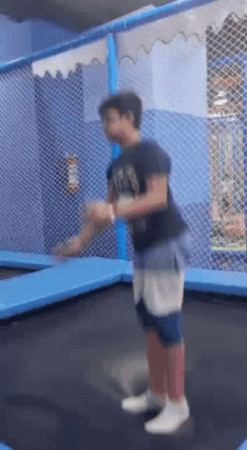 Boy Jumping On Trampoline With RS Shirt GIF