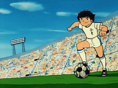 Boy Kicking Soccer Ball With Chinese Writing On Jersey GIF