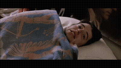 Boy Laying On Bed With Blue Blanket Saying A GIF