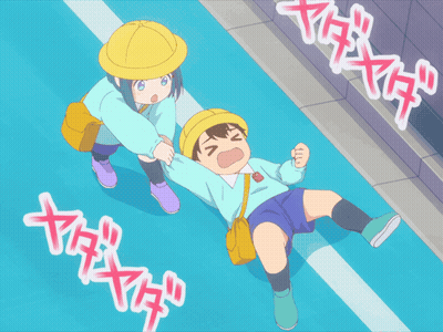Boy Laying on Ground With Girl Standing Next to Him