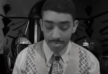 Boy Lighting And Smoking Cigar Grayscale GIF