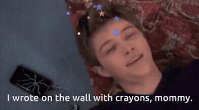 Boy Lying On Couch With Crayon Wall Art GIF