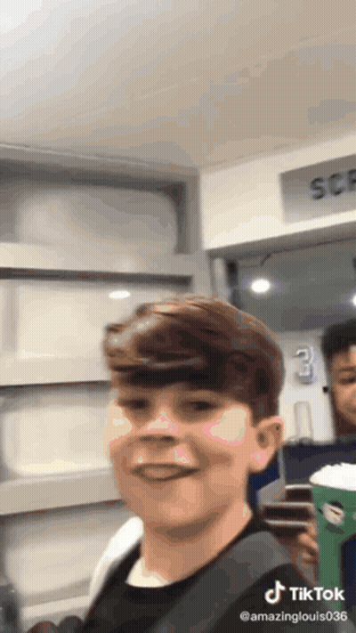 Boy Making Funny Face With Coffee GIF