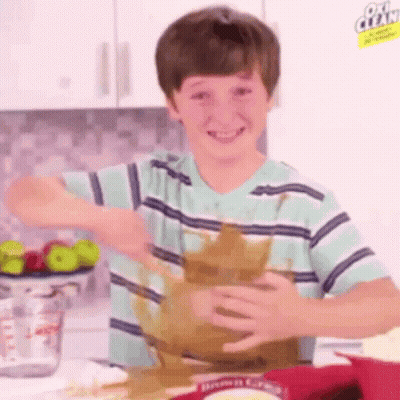 Boy Making Mess With Brownie Mix GIF