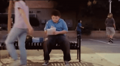 Boy On Bench Reading Book, Girl Walking By GIF