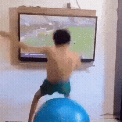 Boy On Blue Exercise Ball Before TV GIF