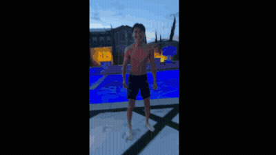 Boy On Ledge In Black Jacket Orange Shoes GIF