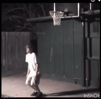 Boy Playing Basketball In Backyard At Night GIF