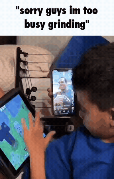 Boy Playing Video Game On Tablet Another Boy On Phone GIF