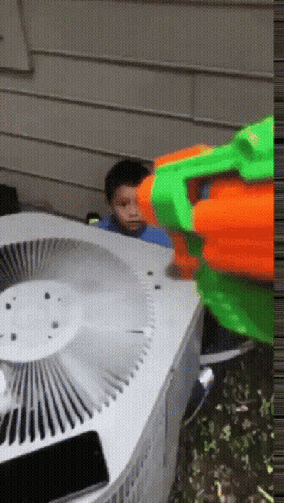 Boy Playing With Nerf Gun GIF