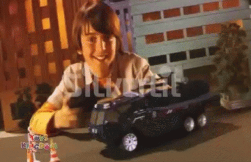 Boy Playing With Toy Kingdom Truck GIF