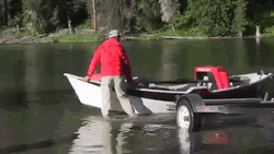 Boy Pulling Skiff Near Him GIF