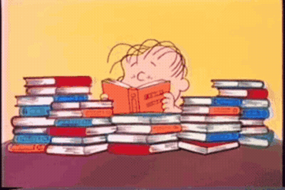 Boy Reading Book Surrounded By Books GIF