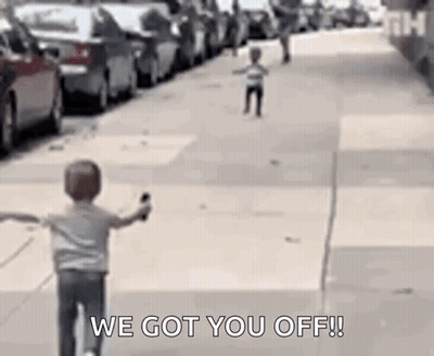 Boy Riding Bike With Another Boy Running Behind GIF