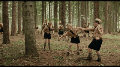 Boy Scouts In Woods With O On Uniform GIF
