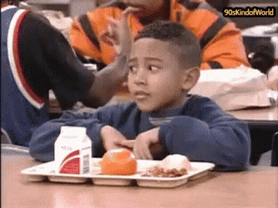 Boy Sitting At Table With Food And Milk GIF