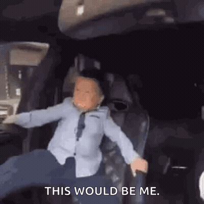 Boy Sitting In Car With Outstretched Arms GIF
