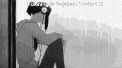 Boy Sitting In Front Of Window Wearing Headphones GIF