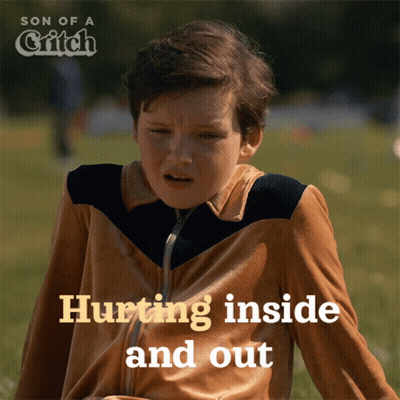 Boy Sitting In Grass Hurting Inside And Out GIF