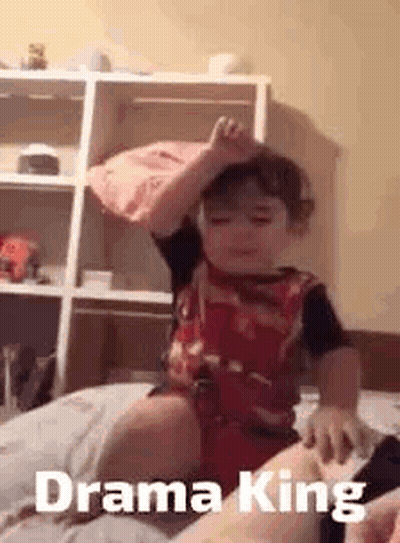 Boy Sitting On Bed With Crown GIF